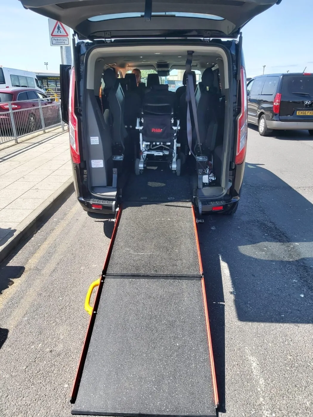 Wheelchair access ramp and interior in an accessible travel vehicle.